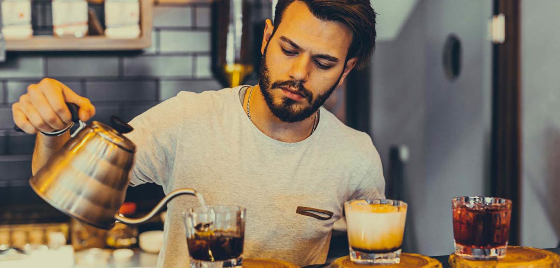man pouring coffees