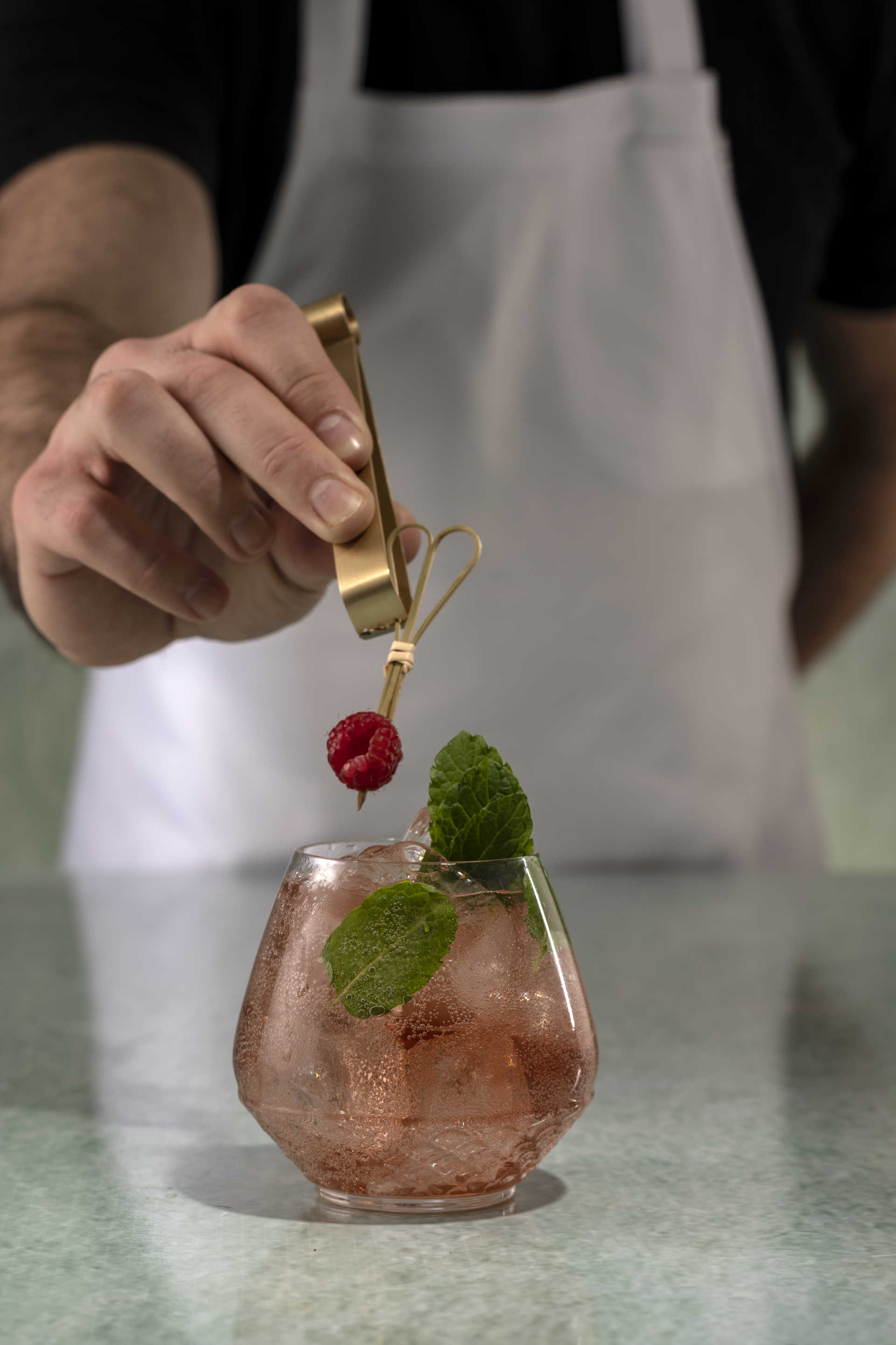 Bartender garnishing a cocktail