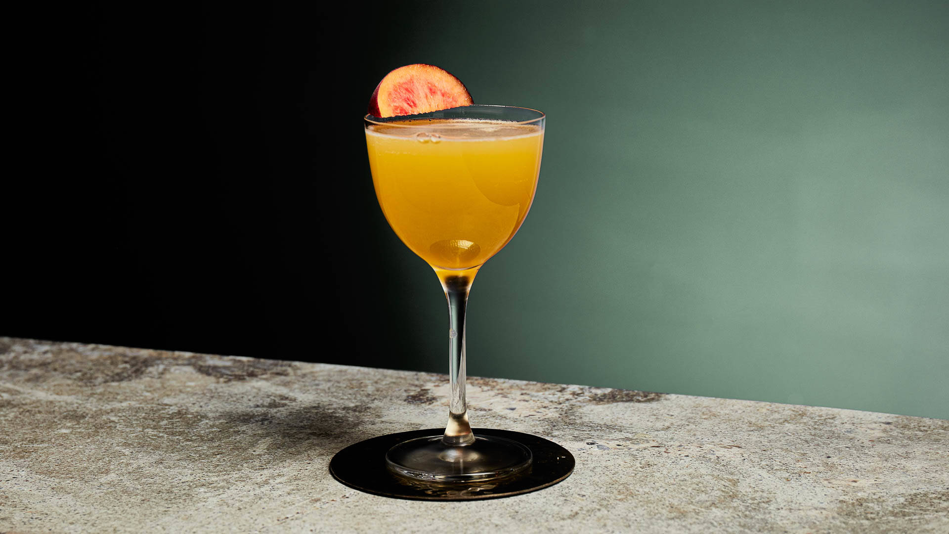 A glass of Chilliana on a marble counter