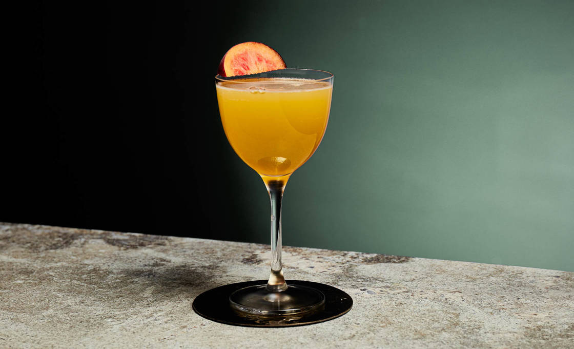 A glass of Chilliana on a marble counter