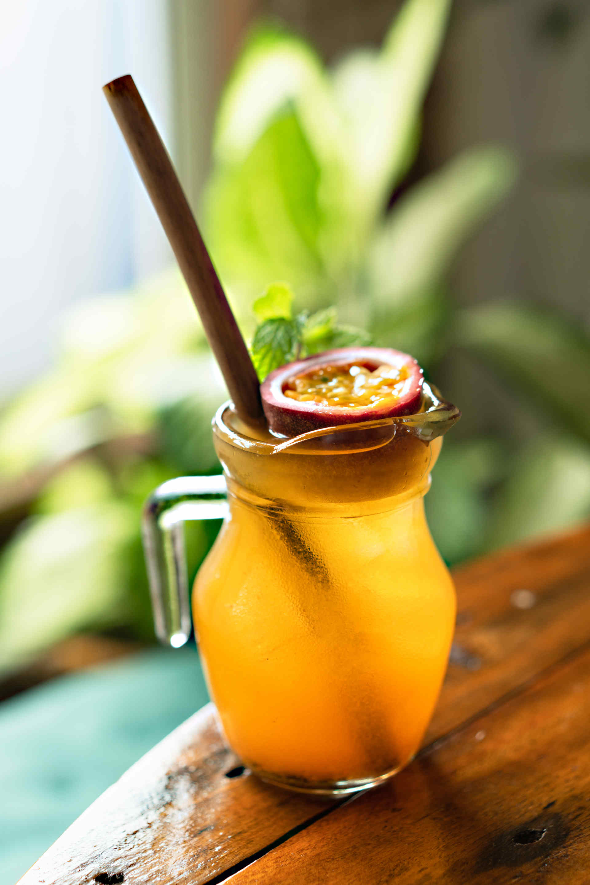 A glass of orange and passion fruit soda on a transparent background