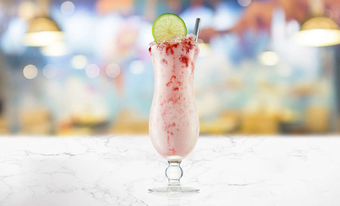 Hibiscus Colada cocktail on a marble surface