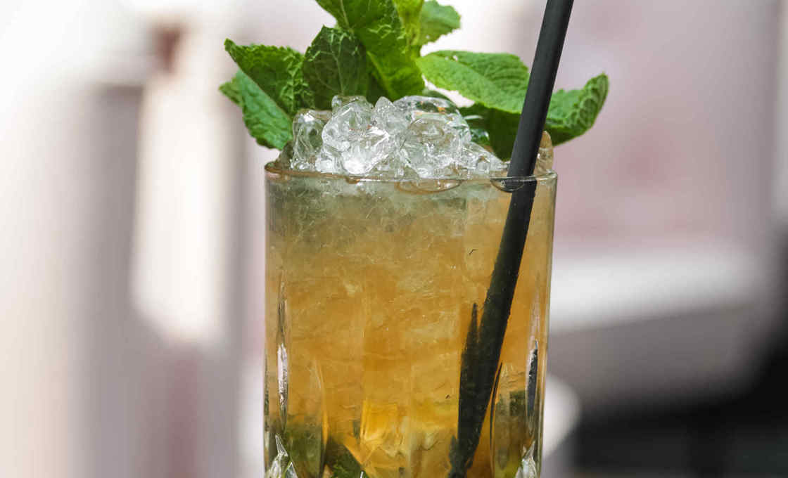 A close up of a glass of Green Mint Soda