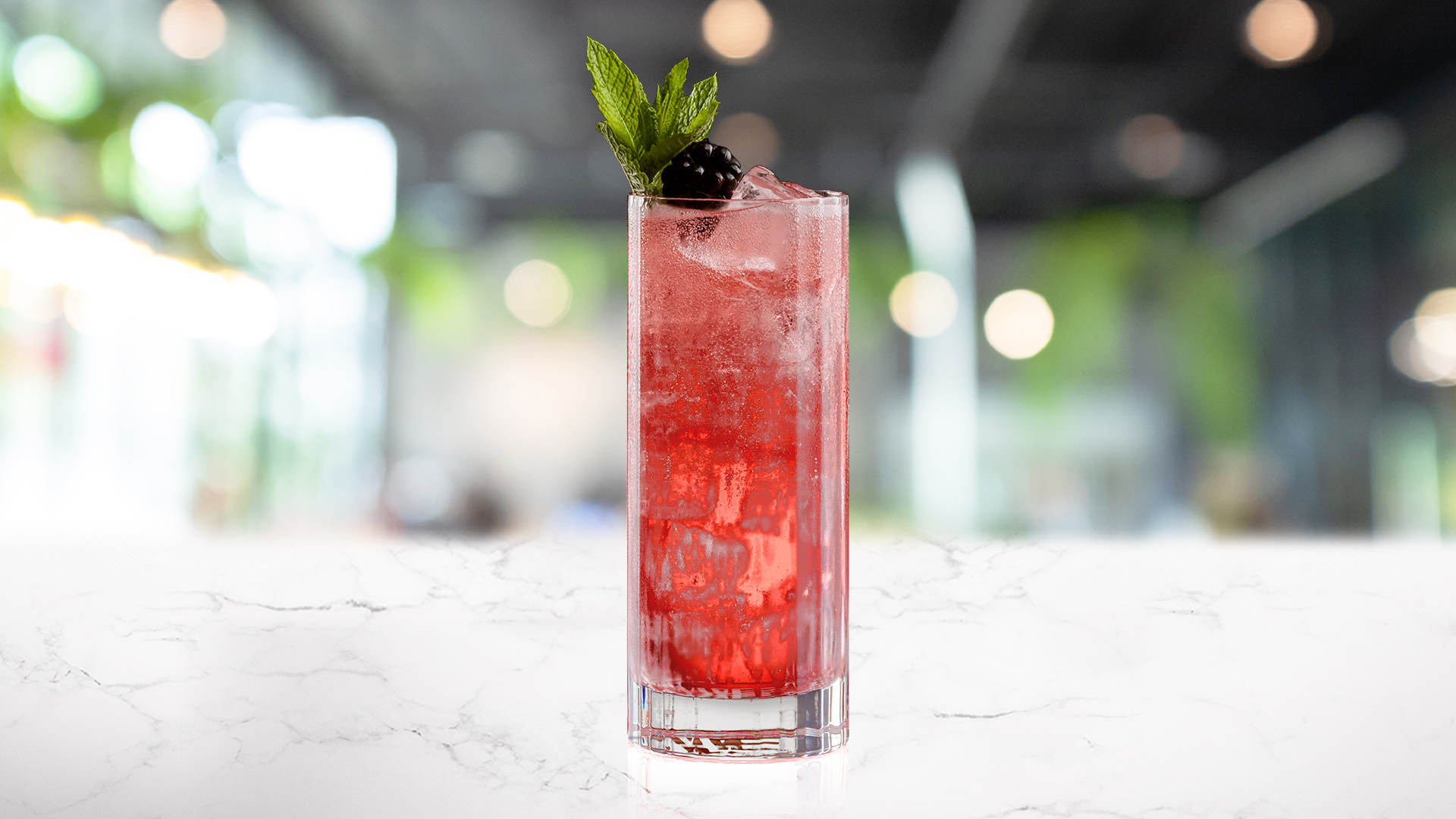 Glass of Baie Rouge on a marble surface