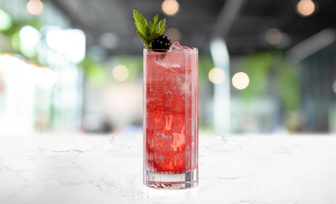Glass of Baie Rouge on a marble surface