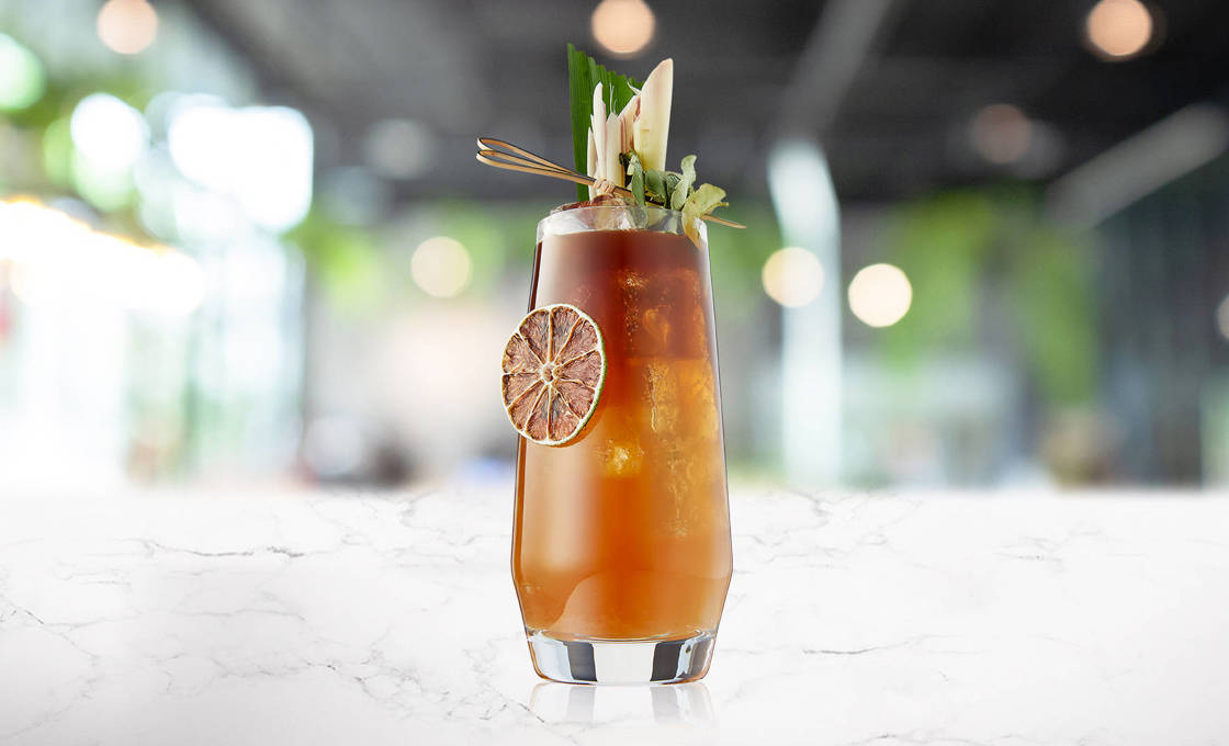 Garnished glass of Pomegranate Tea'ade