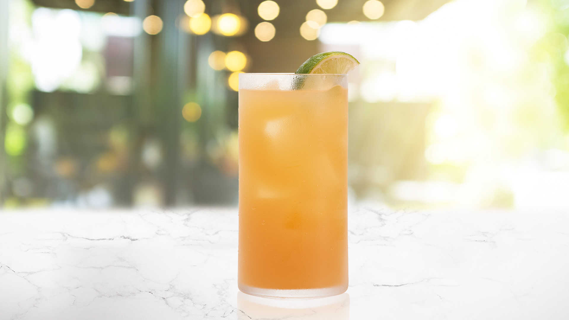 Glass of Apple Passion on a marble surface