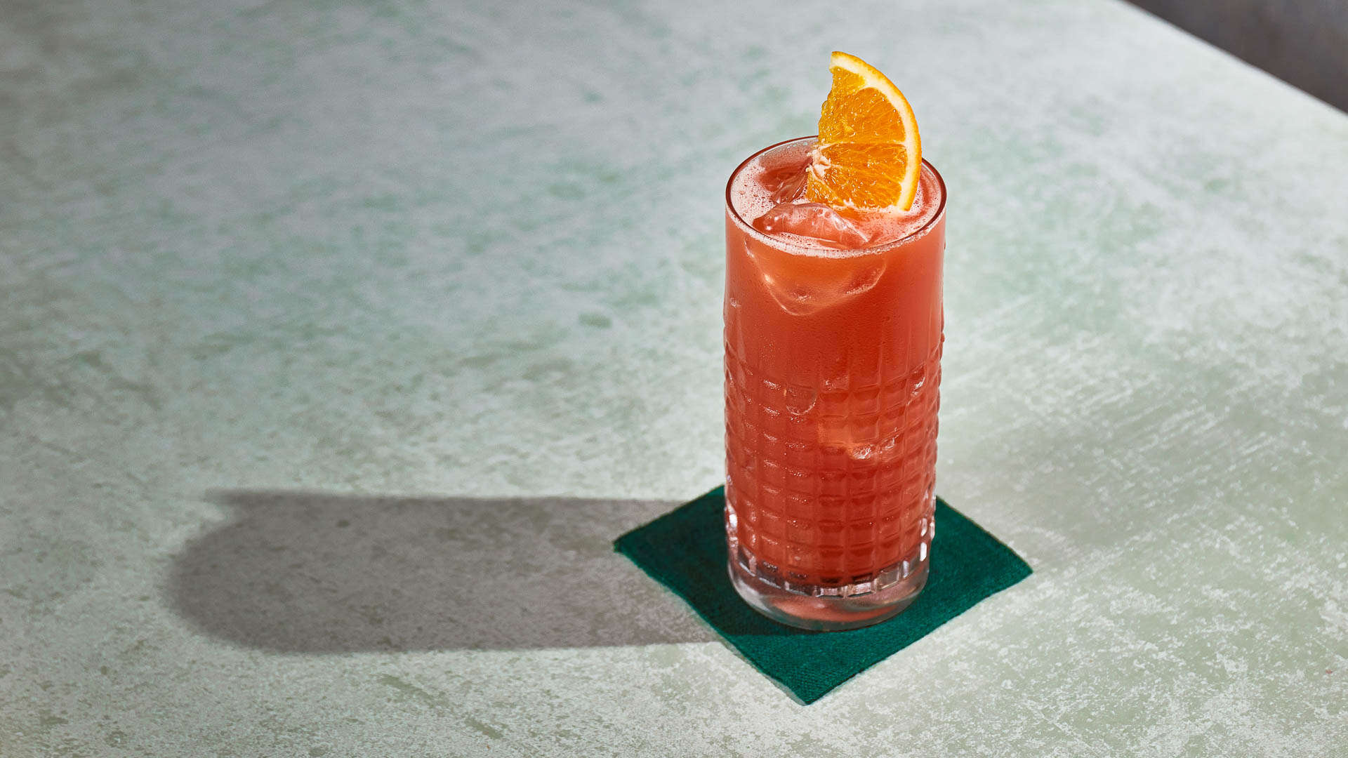 A glass of Amazon on a napkin