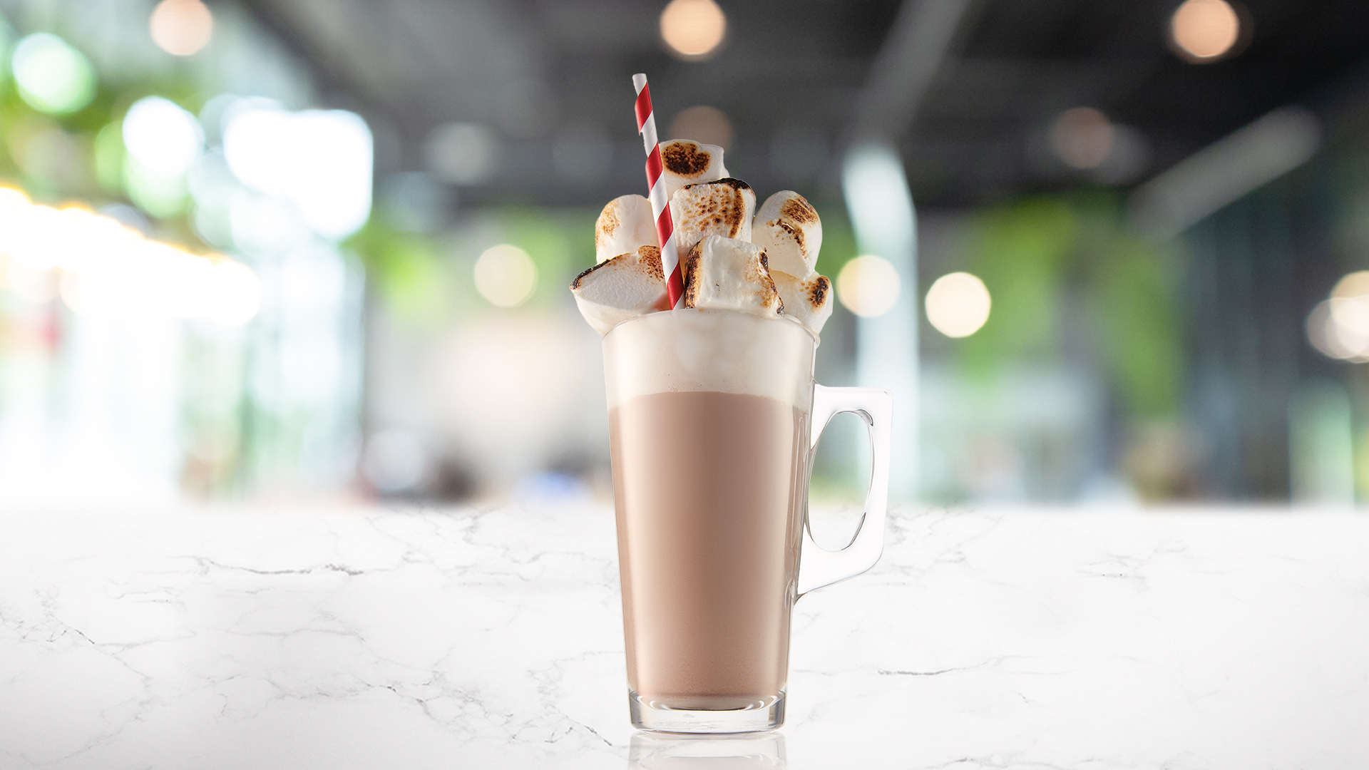 Glass of Popcorn Latte with popcorn garnish