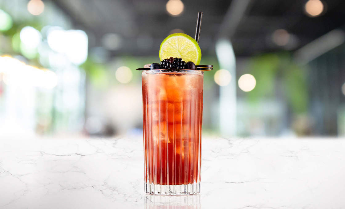 Glass of Blackcurrent & Black Tea on a marble surface