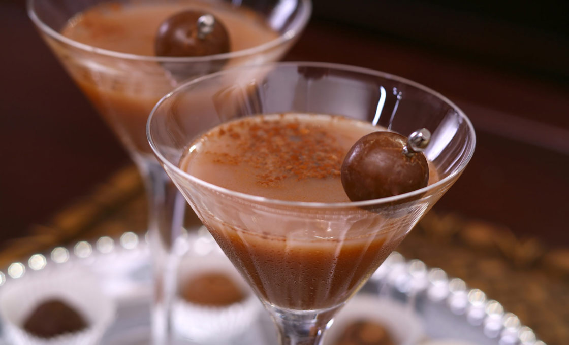 Two glasses of Mon Cheri cocktail on a silver tray