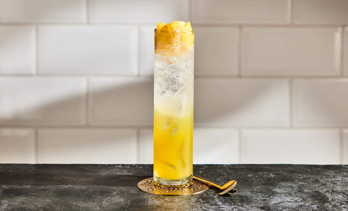 Cactus Pineapple Punch on a dark stone surface against a white tile wall