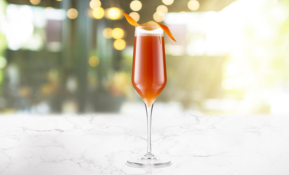 A glass of Pomegranite Mango Bellini