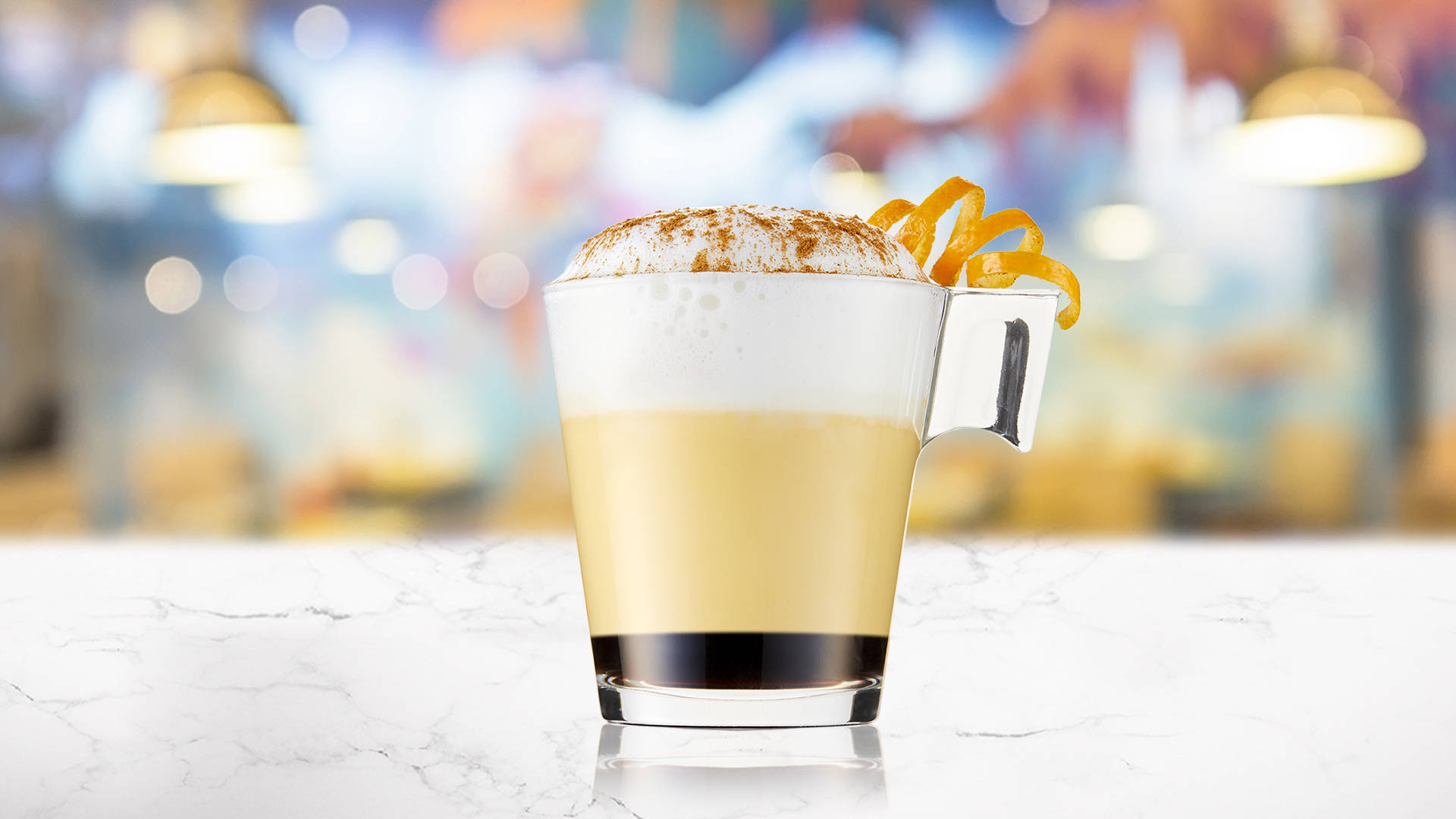 Glass of Black Pumpkin Latte on a marble surface