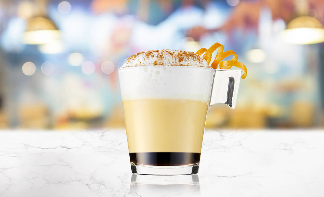 Glass of Black Pumpkin Latte on a marble surface