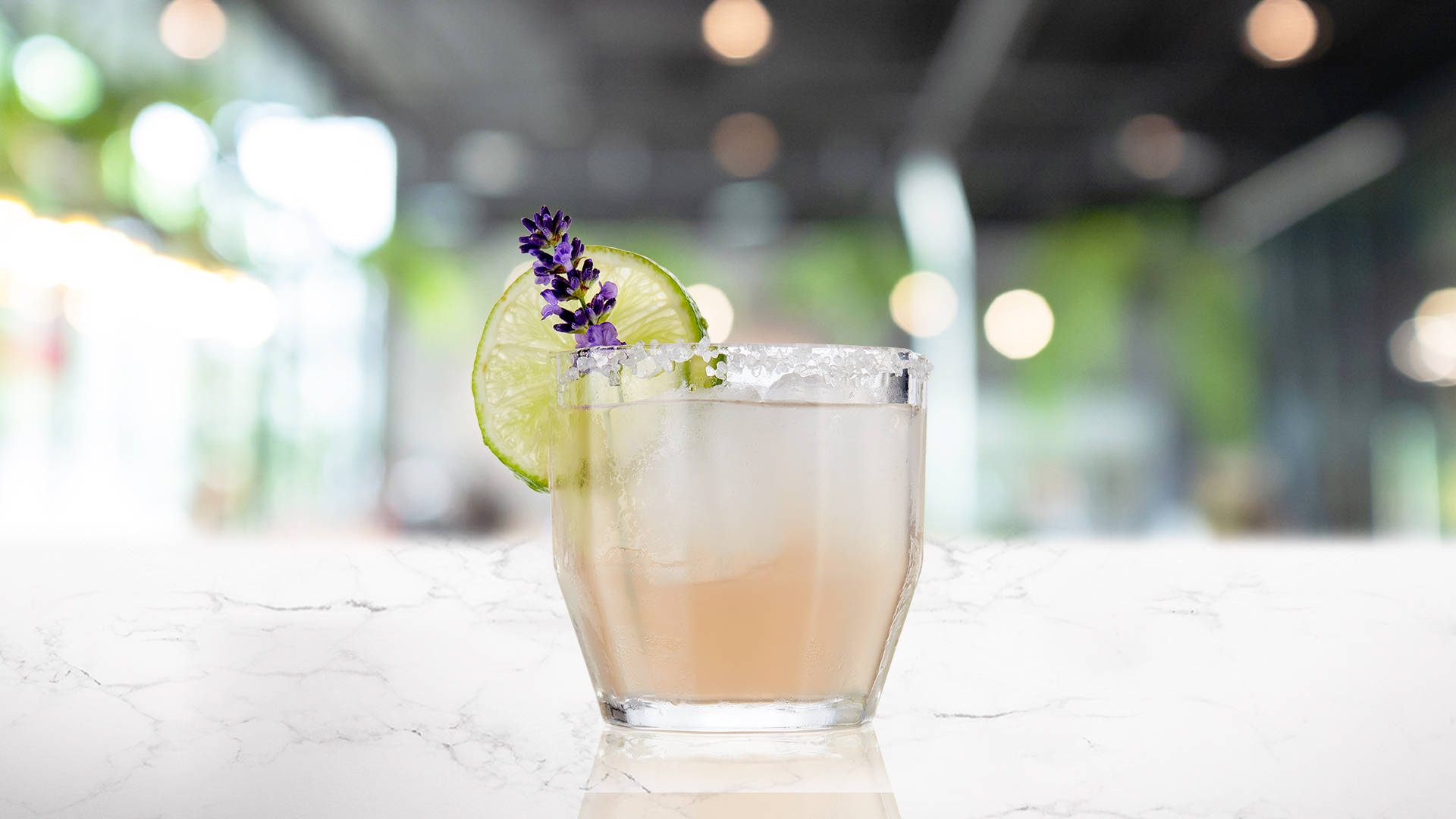 Glass of Lavenderita on a marble surface