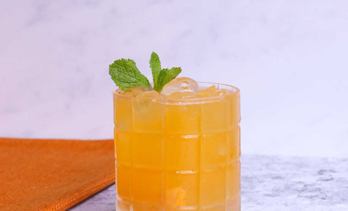 Glass of Fruit Punch Fizz on a marble surface