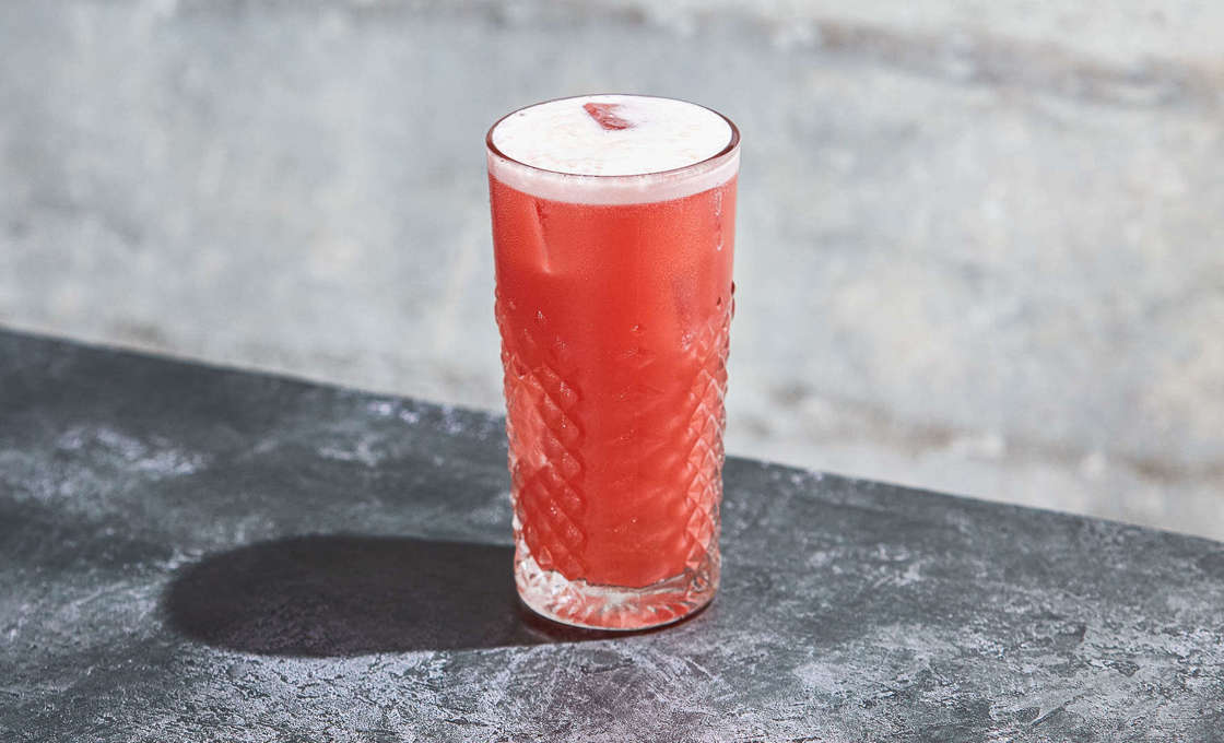 A glass of Forest Touch on a granite surface