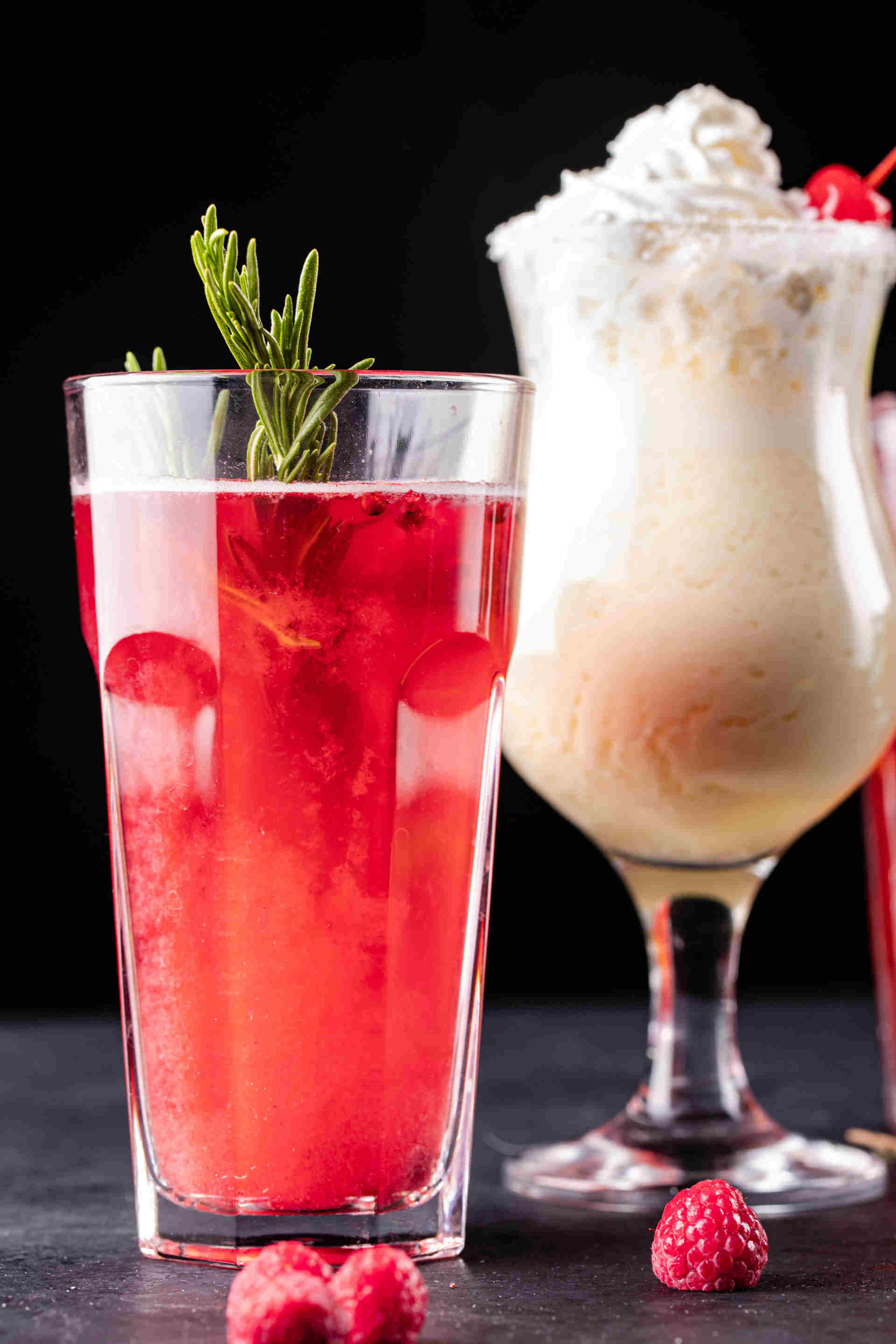 Glass of Pomegranate Lemonade with another drink in the background